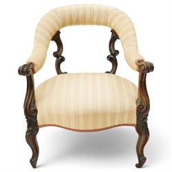 Mid-Victorian carved mahogany open armchair, the sweeping bow-shaped padded back and arm r...